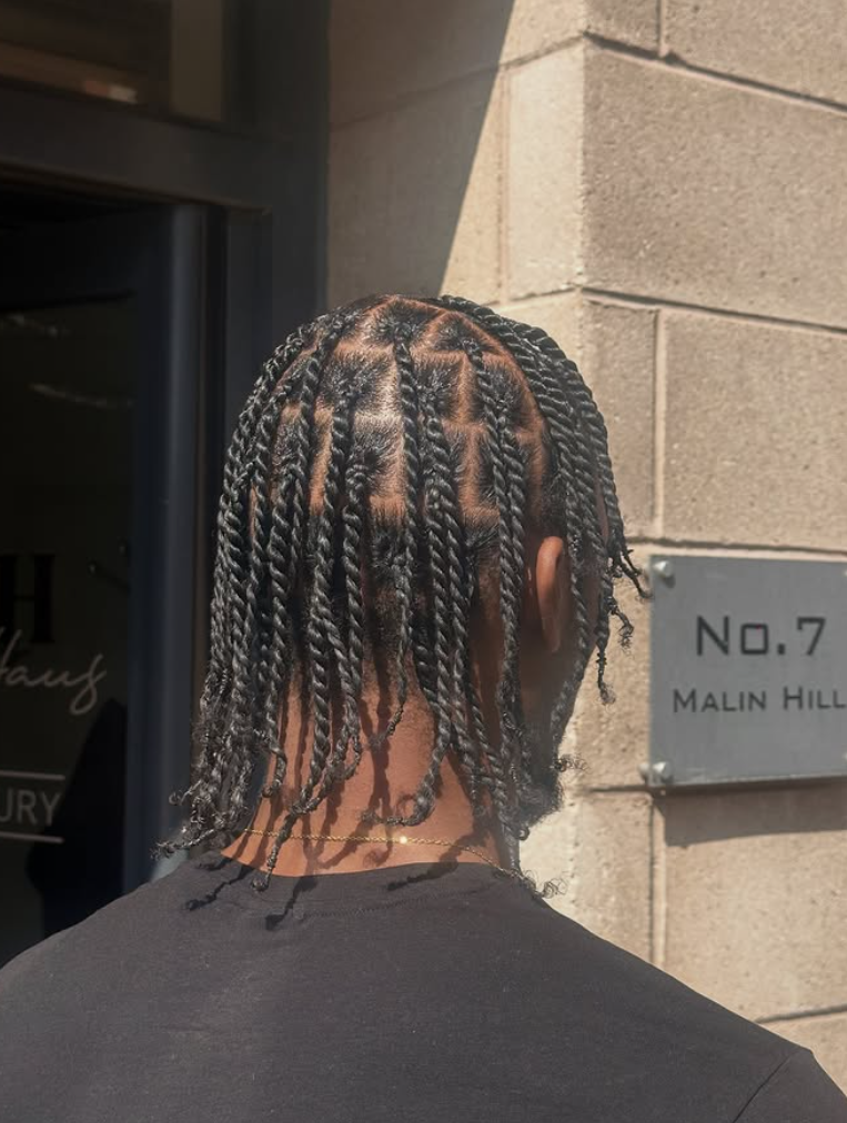 Two-strand twists on shoulder-length hair by Styled by PN