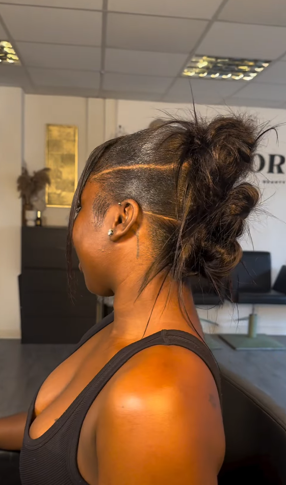 Textured updo with sleek edges by Styled by PN