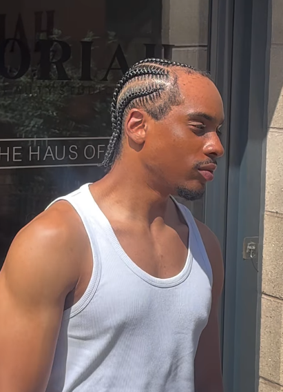 Feed-in cornrows with clean parting by Styled by PN